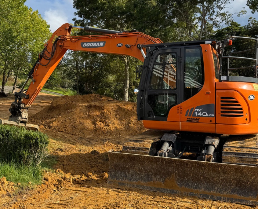 image of an excavator on a rural property